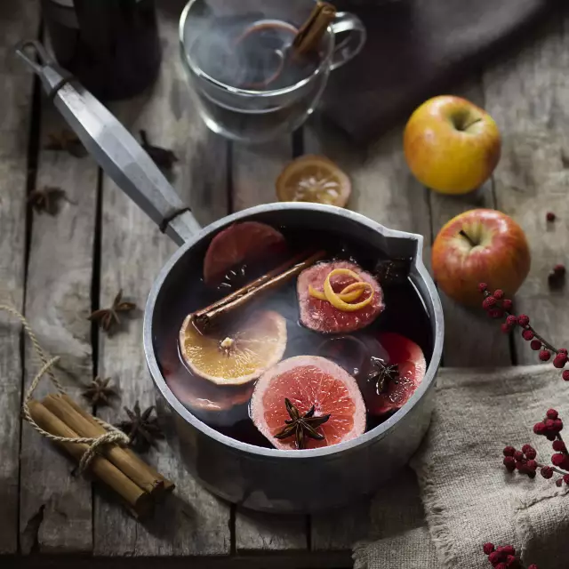 vintner's mulled wine in a pot with spices such as orange, cinnamon and vanilla